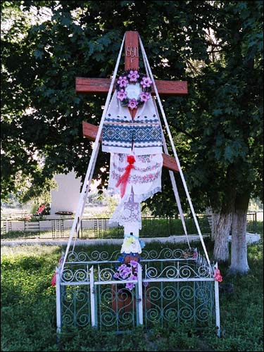  - Orthodox church of the Assumption. The Cross at road