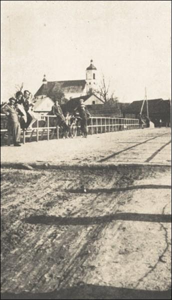  - Catholic church of the Holy Trinity. View at the church from the bridge over Łań river
